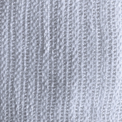 Close up of white open weave blanket